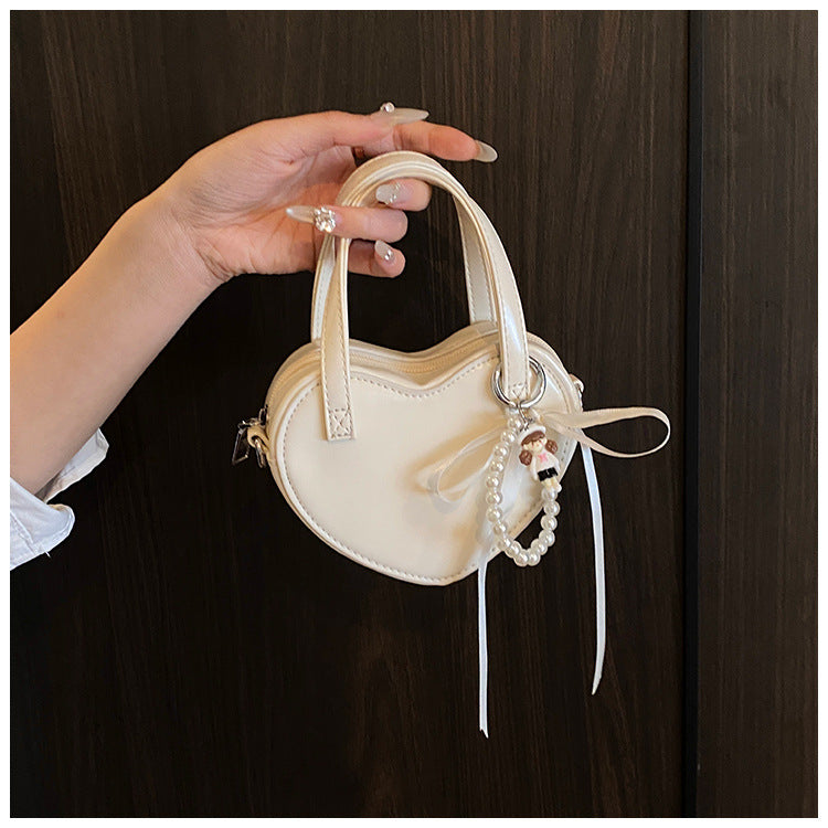 韓国ガーリーハートパールリボンミニクロスボディバッグ 2025年夏新作